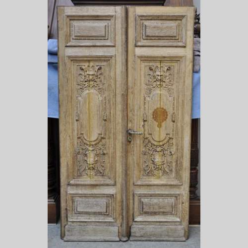 Carved oak wood double door with grotesque decor