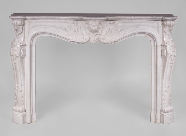 Beautiful antique Louis XV style fireplace with rich decor in white Carrara marble Beautiful antique Louis XV style fireplace with rich decor in white Carrara marble-0