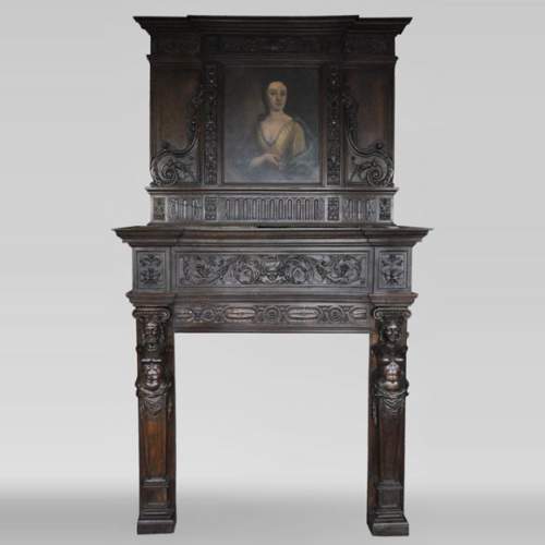 Antique Neo-Renaissance fireplace in oak with a portrait of woman