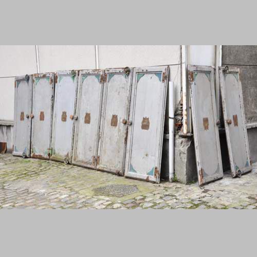 Antique set of eight industrial boiler room doors 