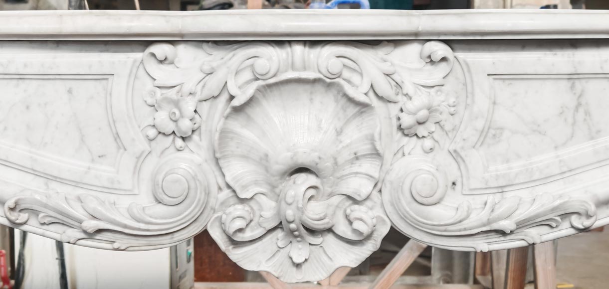 Louis XV style fireplace in Carrara marble, richly decorated with shells and flowers Louis XV style fireplace in Carrara marble, richly decorated with shells and flowers-1