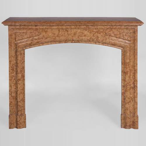 An antique Louis XIV style fireplace made out of Rosso di Verona marble