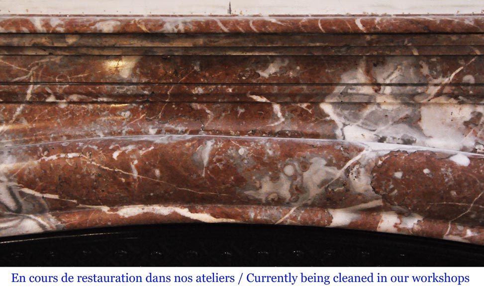 An antique Louis XIV style fireplace, made out of Rouge Royal marble An antique Louis XIV style fireplace, made out of Rouge Royal marble-1