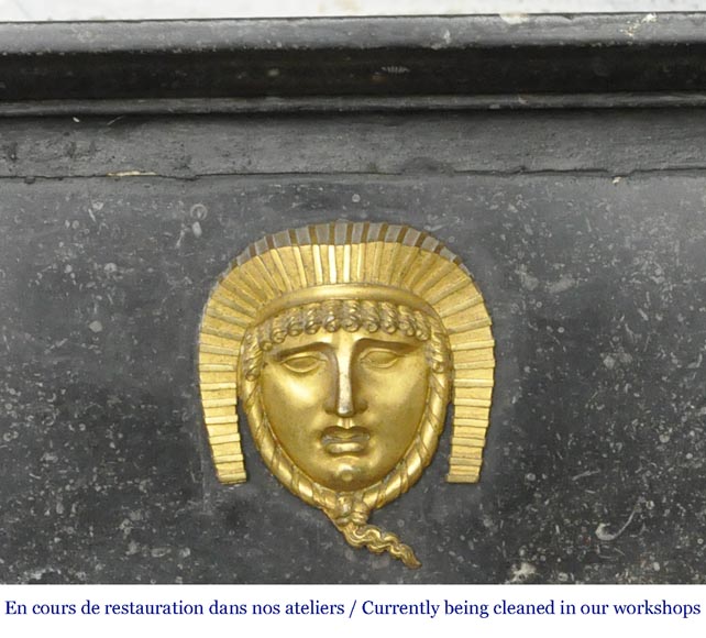 An antique Empire fireplace made out of black marble, witrh bronze ornaments and detached columns An antique Empire fireplace made out of black marble, witrh bronze ornaments and detached columns-1