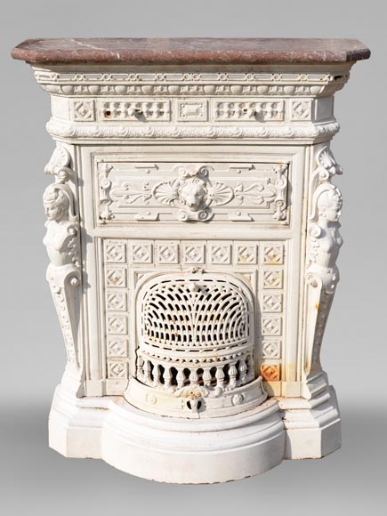 Antique cast iron stove in the Napoleon III style decorated with caryatids Antique cast iron stove in the Napoleon III style decorated with caryatids-0