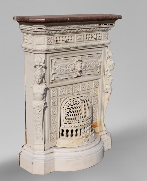 Antique cast iron stove in the Napoleon III style decorated with caryatids Antique cast iron stove in the Napoleon III style decorated with caryatids-2