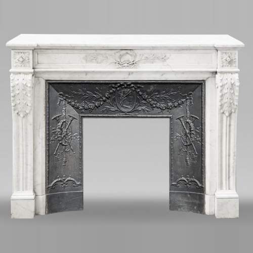 Louis XVI style fireplace decorated with a laurel wreath, in Carrara marble
