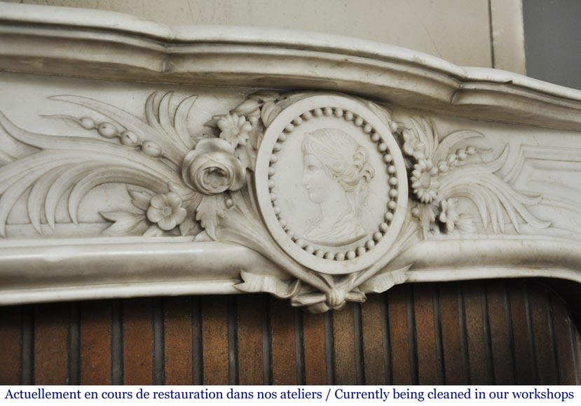 Antique Napoleon III fireplace with a woman's profile decoration in a medallion Antique Napoleon III fireplace with a woman's profile decoration in a medallion-2