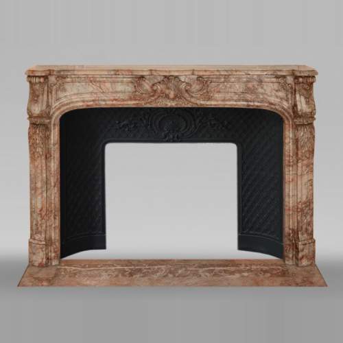 Antique Regence style mantel richly sculpted in Escalettes marble
