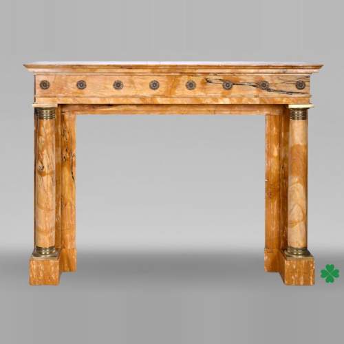 Empire style fireplace in Sienna yellow marble with columns and gilt bronze rosettes