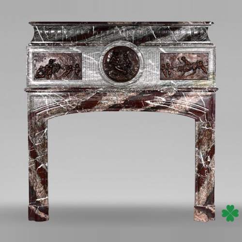 Campan marble fireplace in the Louis XIV style, with bronzes after Clodion