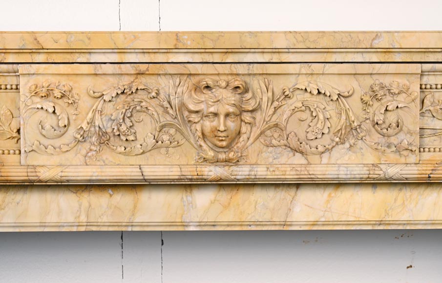 Large Louis XVI style mantel in yellow Sienna marble with entablature adorned with the head of Apollo and arrow heads on the jambs Large Louis XVI style mantel in yellow Sienna marble with entablature adorned with the head of Apollo and arrow heads on the jambs-1
