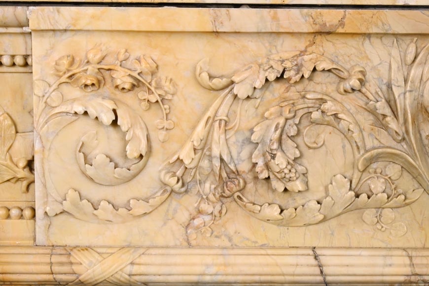 Large Louis XVI style mantel in yellow Sienna marble with entablature adorned with the head of Apollo and arrow heads on the jambs Large Louis XVI style mantel in yellow Sienna marble with entablature adorned with the head of Apollo and arrow heads on the jambs-3