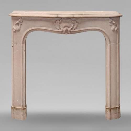 Curved Louis XV style stone mantel
