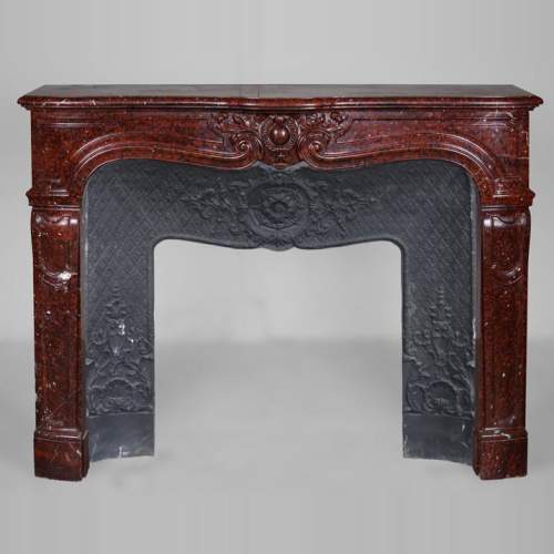 Beautiful Griotte Red marble mantel with a cabochon in an ancanthus leaves surround