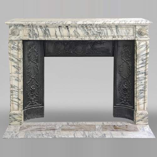 Louis XVI style fireplace with peals edges in veined Carrara marble