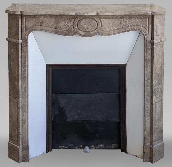 An antique Louis XV style fireplace, Pompadour model, in Lunel marble An antique Louis XV style fireplace, Pompadour model, in Lunel marble-0