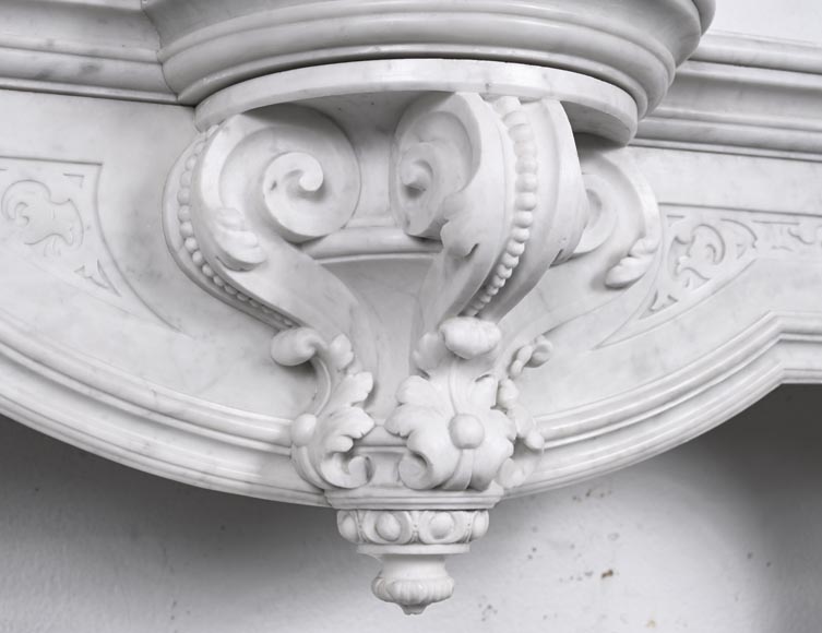 A richly sculpted Carrara marble fireplace in the Napoleon III style, decorated with a lion's head. A richly sculpted Carrara marble fireplace in the Napoleon III style, decorated with a lion's head.-2