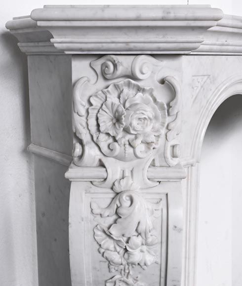 A richly sculpted Carrara marble fireplace in the Napoleon III style, decorated with a lion's head. A richly sculpted Carrara marble fireplace in the Napoleon III style, decorated with a lion's head.-5