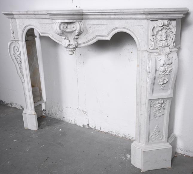 A richly sculpted Carrara marble fireplace in the Napoleon III style, decorated with a lion's head. A richly sculpted Carrara marble fireplace in the Napoleon III style, decorated with a lion's head.-8