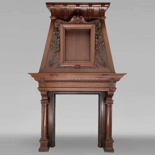 Large Neo-Renaissance walnut mantel with carved scrollwork