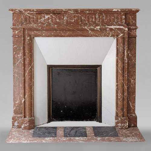Louis XVI style mantel with acroterion in Rouge du Nord marble