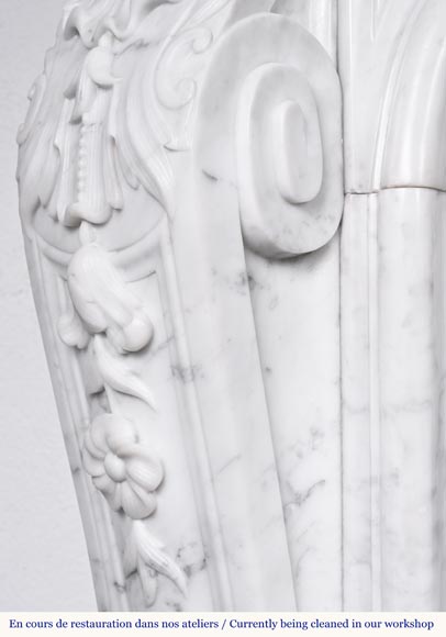 A highly sculpted Louis XV style fireplace in Carrara marble, decorated with a shell motif. A highly sculpted Louis XV style fireplace in Carrara marble, decorated with a shell motif.-8