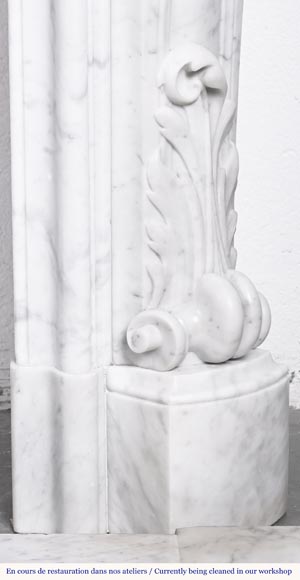 A highly sculpted Louis XV style fireplace in Carrara marble, decorated with a shell motif. A highly sculpted Louis XV style fireplace in Carrara marble, decorated with a shell motif.-13