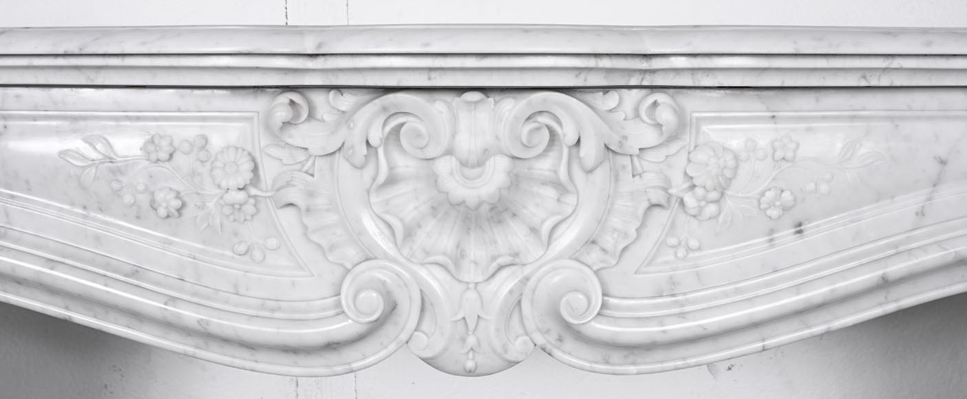 Louis XV style fireplace in Carrara marble, decorated with a floral shell motif Louis XV style fireplace in Carrara marble, decorated with a floral shell motif-1