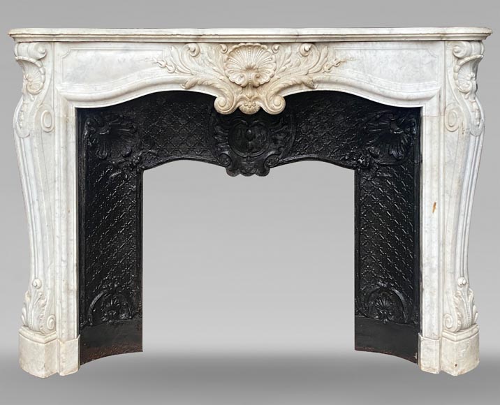 Louis XV style mantel with shell framed by palmettes carved in Carrara marble Louis XV style mantel with shell framed by palmettes carved in Carrara marble-0