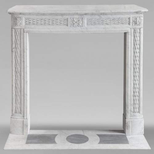 Louis XVI style mantel in Carrara marble decorated with a holly frieze