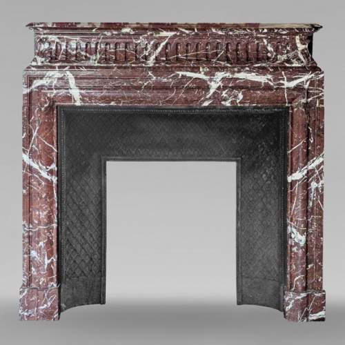 Louis XIV style mantel with acroterion in Rouge du Nord marble