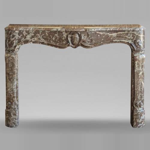 Louis XV period mantel in Rouge du Nord marble