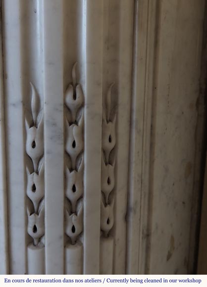 Louis XVI style Carrara marble mantel with rounded corners adorned with a sunflower flower Louis XVI style Carrara marble mantel with rounded corners adorned with a sunflower flower-9