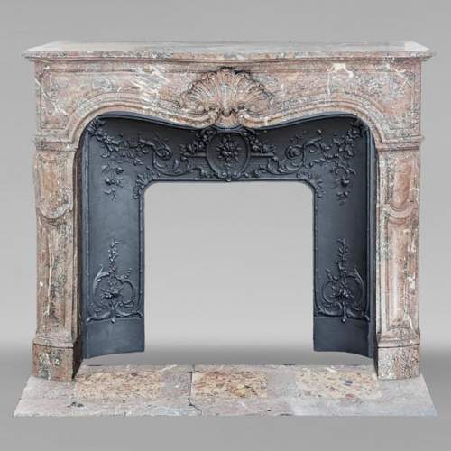 Louis XV style mantel in Red of the North marble with curved shells