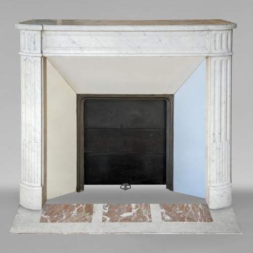 Louis XVI style mantel in veined Carrara marble with fluted legs