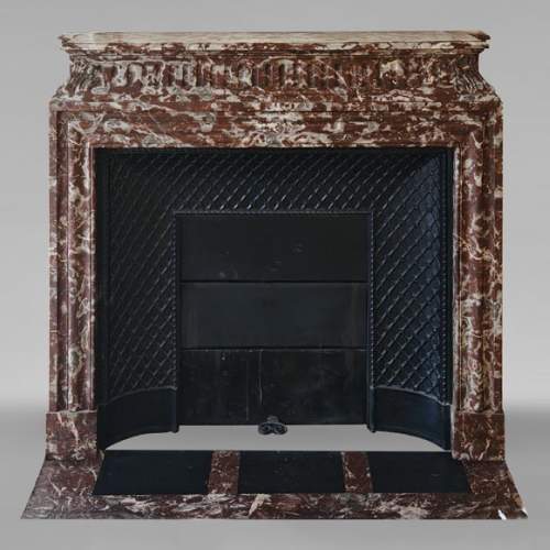 Louis XIV style mantel with acroterion in Rouge du Nord marble