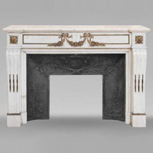 Louis XVI style semi-statuary marble mantel decorated with bronze garlands
