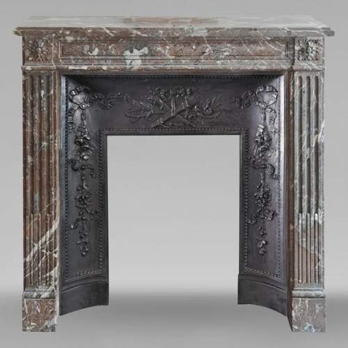 Louis XVI period mantel in Rouge du Nord marble