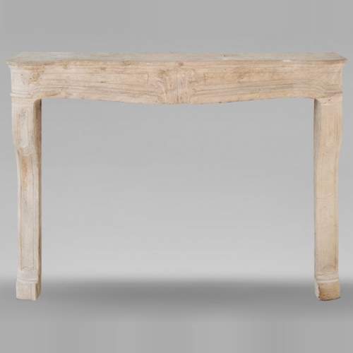 Louis XV period Burgundian mantel carved in stone with palmette motif