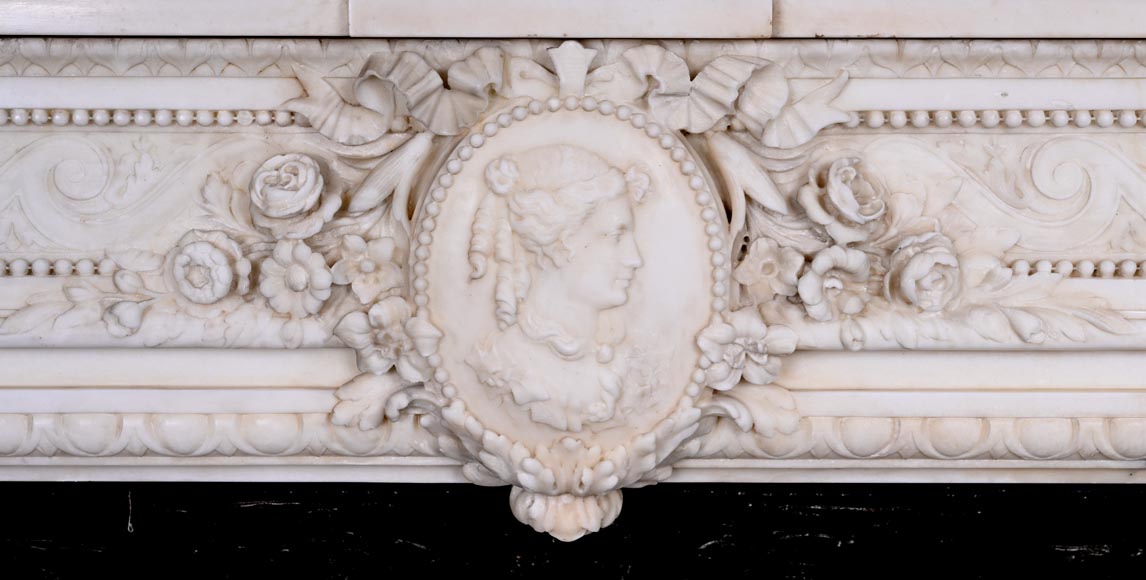 Louis XVI style white marble fireplace with columns and female profile medallion Louis XVI style white marble fireplace with columns and female profile medallion-1