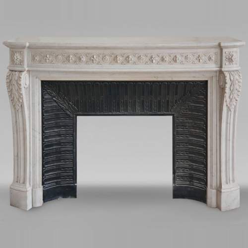 Louis XVI style curved Carrara marble mantel decorated with a frieze of macaroons
