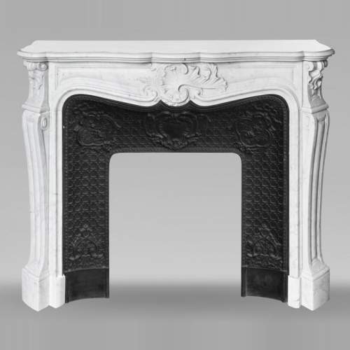 Louis XV style fireplace with an asymmetrical shell, in Carrara marble