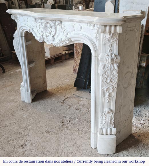 Louis XV style fireplace, highly sculpted in Carrara marble, from northern France Louis XV style fireplace, highly sculpted in Carrara marble, from northern France-9