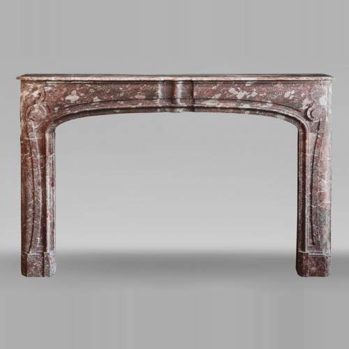Regency period fireplace with scroll decoration in red breccia marble