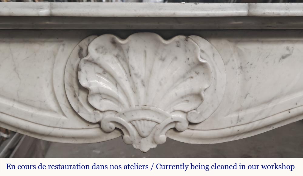 Louis XV style fireplace in Carrara marble decorated with a shell Louis XV style fireplace in Carrara marble decorated with a shell-1