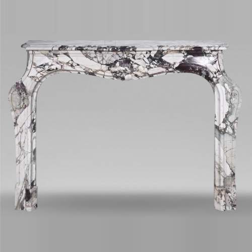 Louis XV style fireplace in purple breccia, decorated with a shell