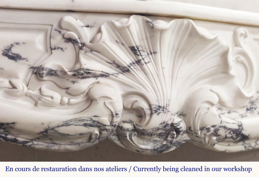 Louis XV style fireplace decorated with a large shell, in Paonazzo marble Louis XV style fireplace decorated with a large shell, in Paonazzo marble-1