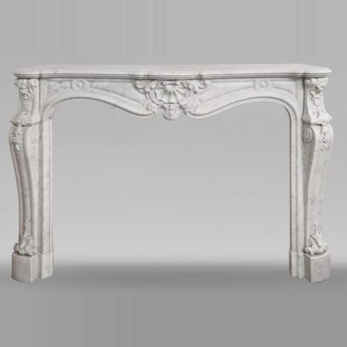 Large Louis XV style fireplace in Carrara marble decorated with shells and flowers