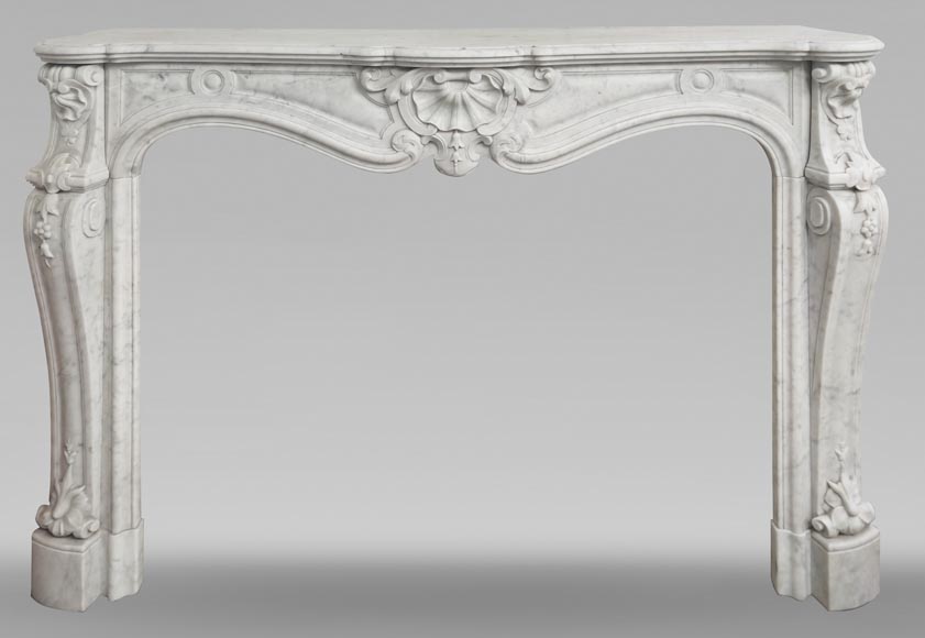 Large Louis XV style fireplace in Carrara marble decorated with shells and flowers Large Louis XV style fireplace in Carrara marble decorated with shells and flowers-0